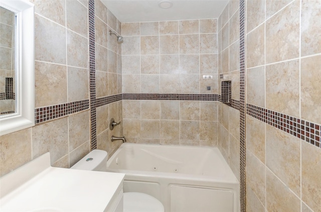 bathroom featuring toilet,  shower combination, and vanity