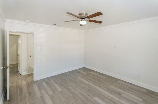 unfurnished room with crown molding, light hardwood / wood-style flooring, and ceiling fan