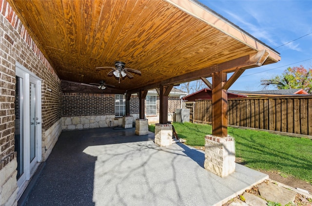 view of patio / terrace with fence and ceiling fan