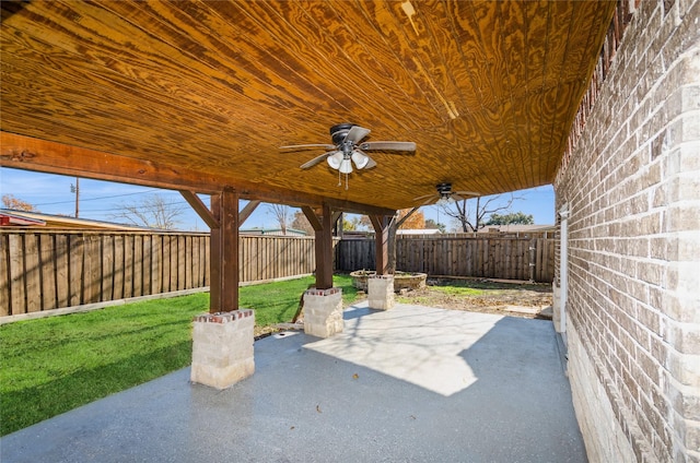 view of patio featuring a fenced backyard and a ceiling fan