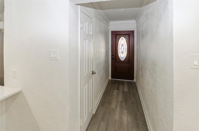 doorway featuring hardwood / wood-style flooring and ornamental molding