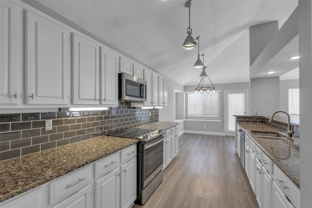 kitchen featuring sink, white cabinets, and appliances with stainless steel finishes