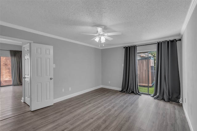 empty room with hardwood / wood-style floors, ceiling fan, ornamental molding, and a textured ceiling