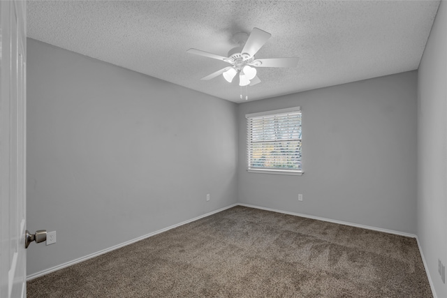 empty room featuring carpet, a textured ceiling, and ceiling fan