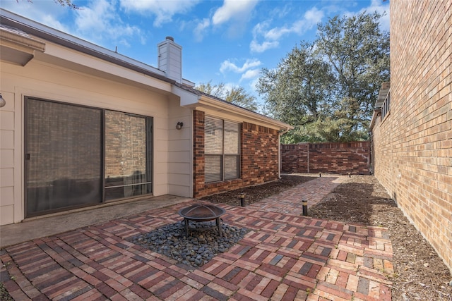 view of patio with an outdoor fire pit