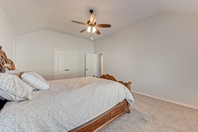 carpeted bedroom with lofted ceiling, ceiling fan, and a closet