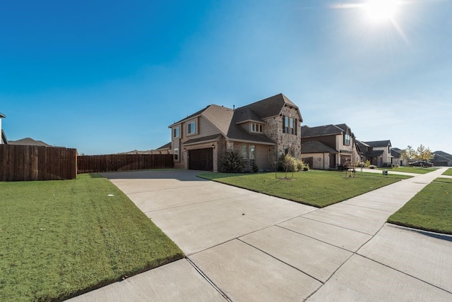 view of front facade with a garage and a front yard