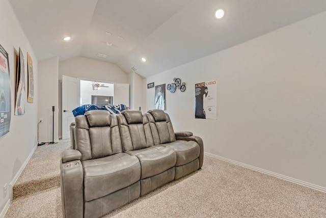 carpeted cinema room featuring lofted ceiling