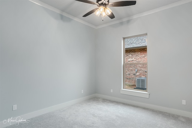 carpeted spare room featuring crown molding and ceiling fan