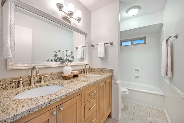 full bathroom featuring bathing tub / shower combination, toilet, vanity, and tile patterned flooring