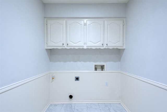 laundry room featuring washer hookup, electric dryer hookup, and cabinets