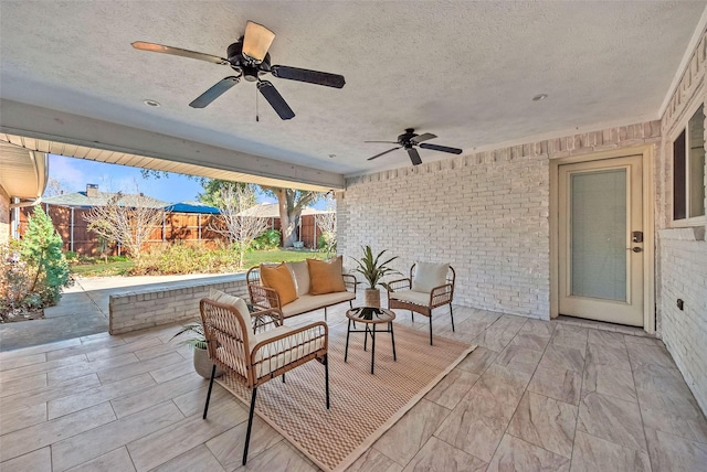 view of patio with ceiling fan and outdoor lounge area