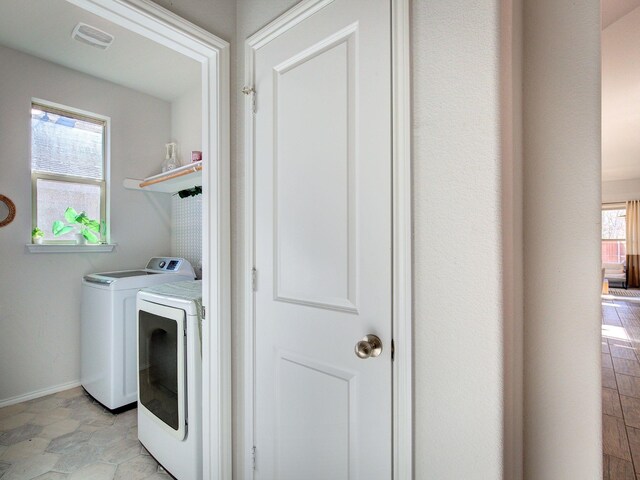 laundry area with separate washer and dryer