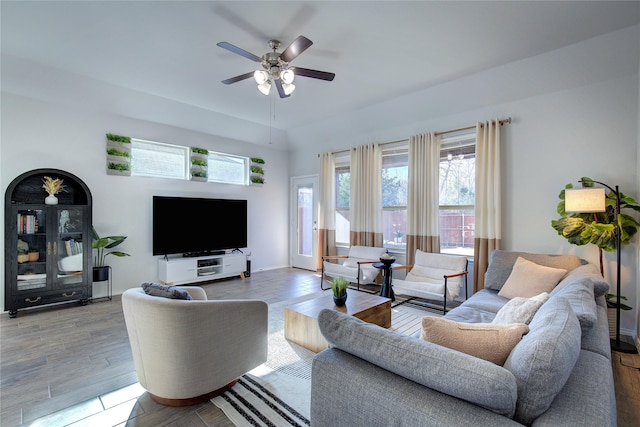 living room featuring ceiling fan and light wood-type flooring