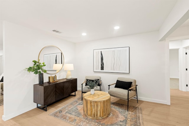 sitting room with light hardwood / wood-style floors