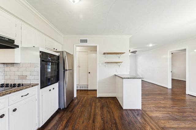 kitchen with gas stovetop, tasteful backsplash, stainless steel fridge, black oven, and white cabinets