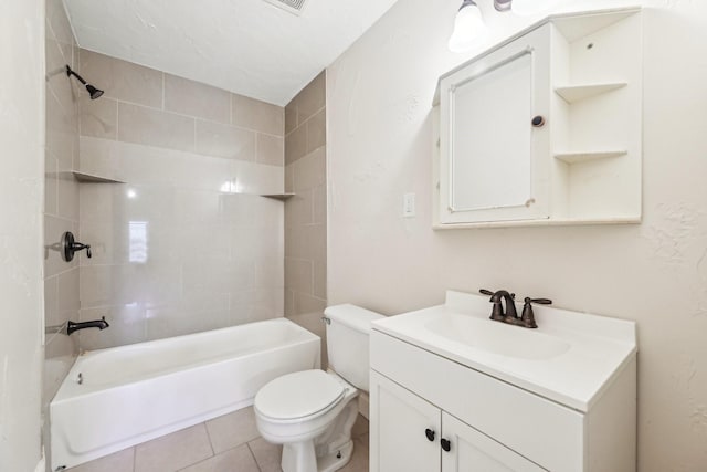 full bathroom featuring tile patterned floors, vanity, toilet, and tiled shower / bath