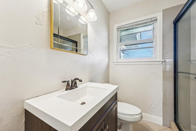 bathroom with tile patterned flooring, vanity, toilet, and an enclosed shower