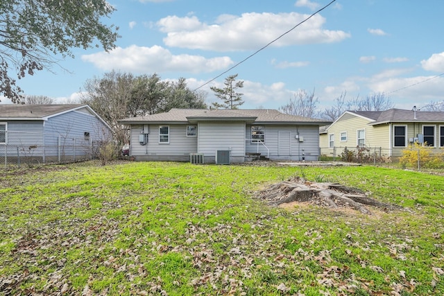 back of property featuring a yard