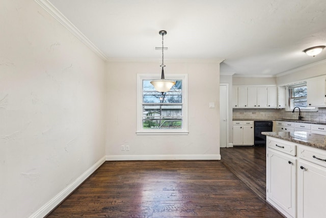 kitchen with backsplash, dark wood-type flooring, dark stone countertops, white cabinets, and hanging light fixtures