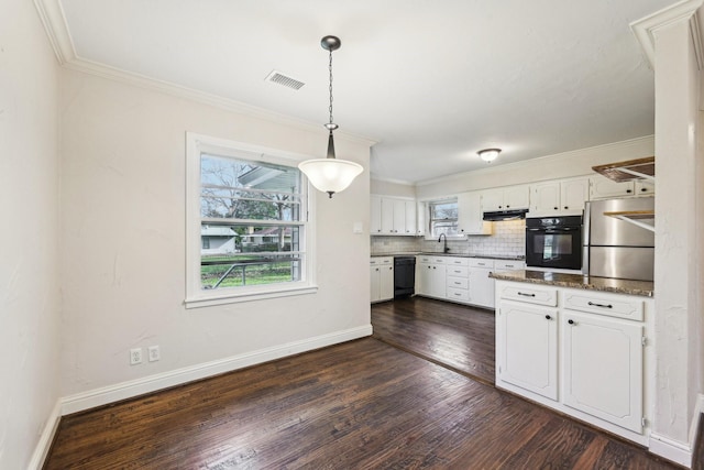 kitchen with dishwasher, hanging light fixtures, decorative backsplash, stainless steel fridge, and white cabinetry