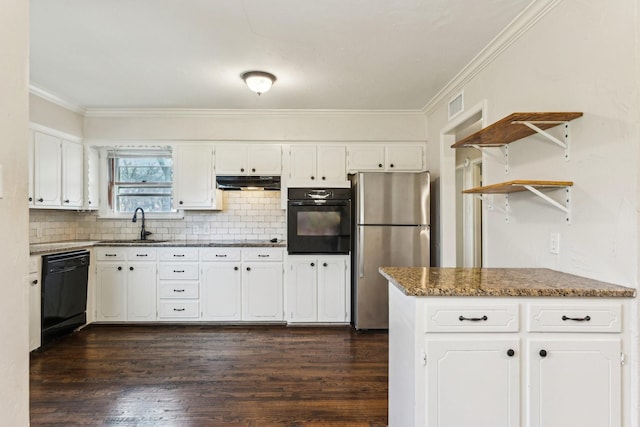 kitchen with dark stone counters, black appliances, white cabinets, tasteful backsplash, and dark hardwood / wood-style flooring