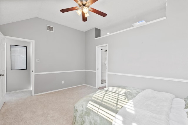 bedroom with ceiling fan, light colored carpet, and vaulted ceiling