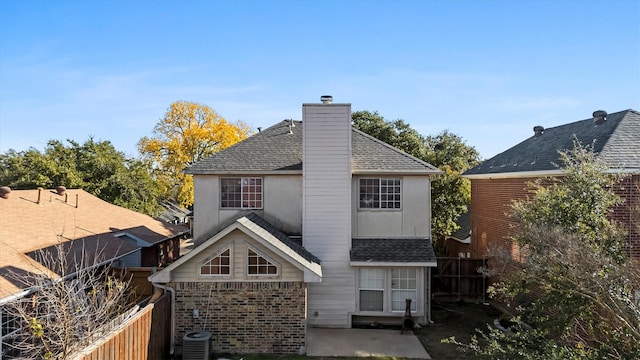 rear view of property with a patio area and central AC unit