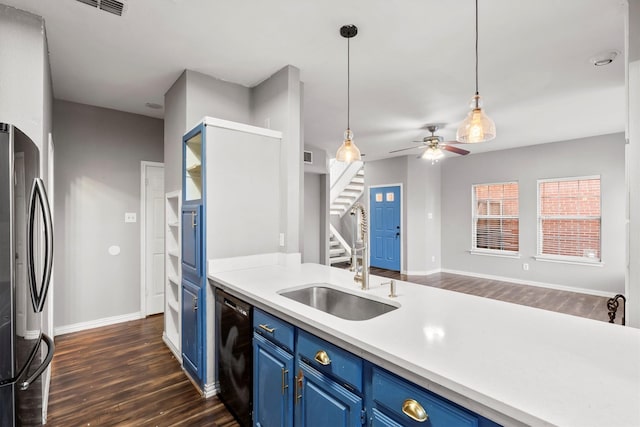 kitchen featuring ceiling fan, dark wood-type flooring, blue cabinetry, dishwasher, and stainless steel refrigerator