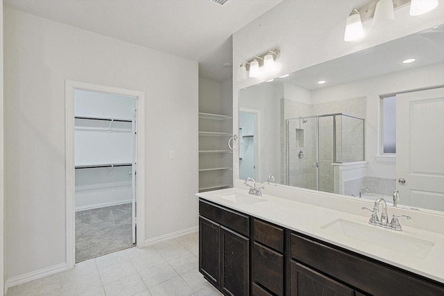 bathroom featuring tile patterned flooring, vanity, and plus walk in shower