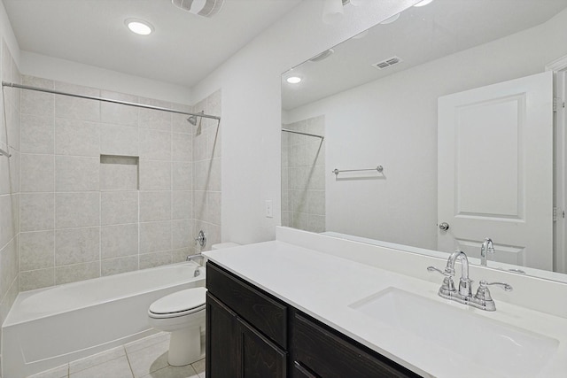 full bathroom with toilet, tile patterned flooring, vanity, and tiled shower / bath