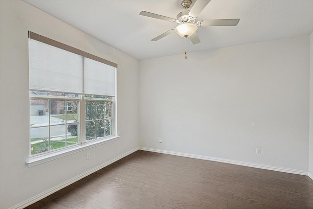 unfurnished room featuring dark hardwood / wood-style floors and ceiling fan