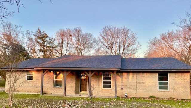 back of house with a yard