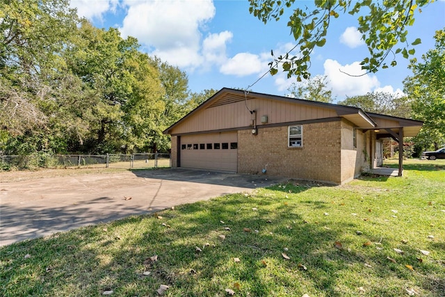 view of property exterior featuring a garage and a yard