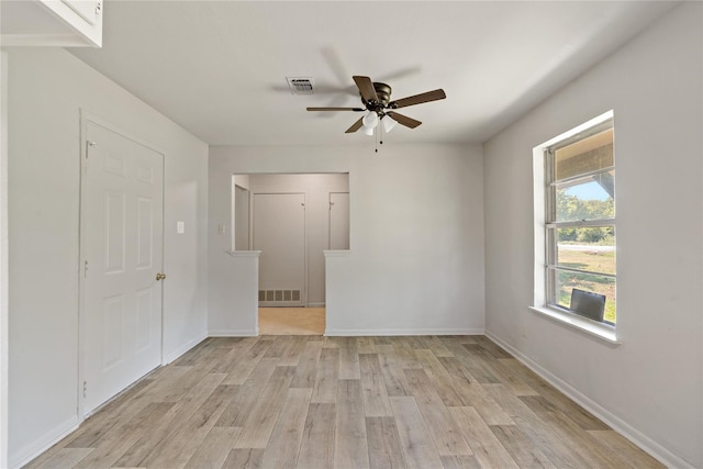 unfurnished room with light hardwood / wood-style floors and ceiling fan