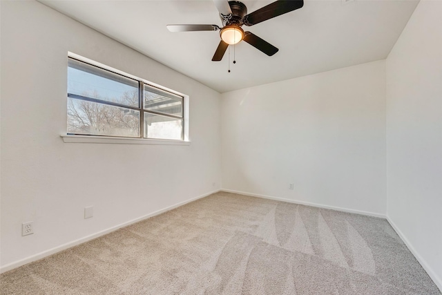 unfurnished room featuring ceiling fan and carpet floors