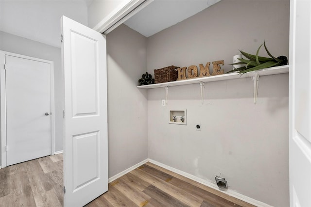 washroom with electric dryer hookup, light hardwood / wood-style floors, and hookup for a washing machine