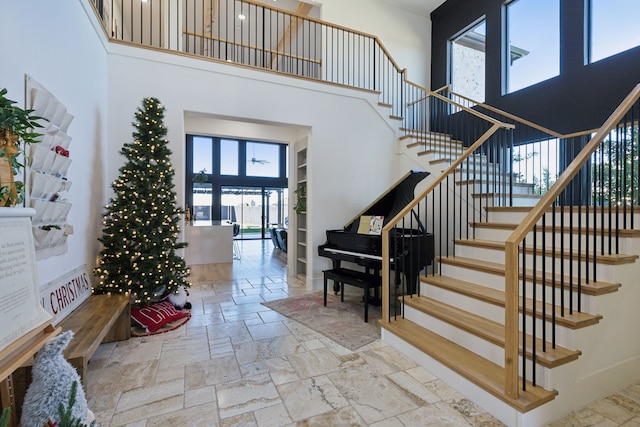 entrance foyer featuring french doors and a high ceiling