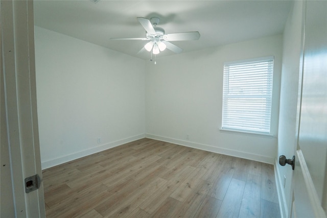 unfurnished room with ceiling fan and light wood-type flooring