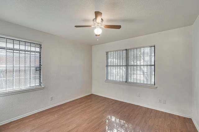 unfurnished room featuring hardwood / wood-style floors, a textured ceiling, and ceiling fan