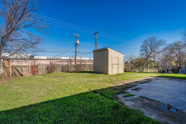 view of yard with a patio area and a storage shed