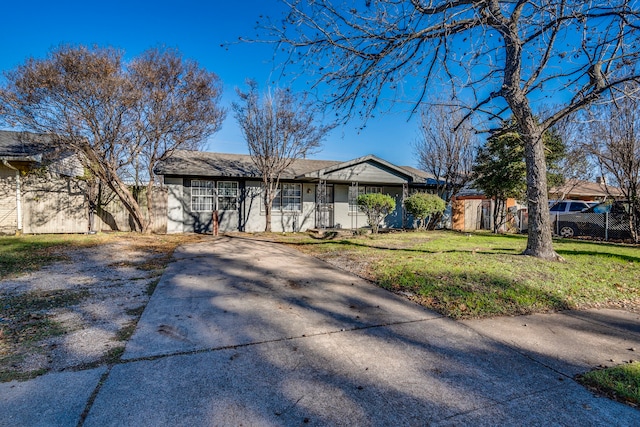 ranch-style home with a front lawn