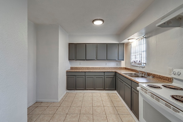 kitchen featuring ventilation hood, white electric range oven, gray cabinets, and sink