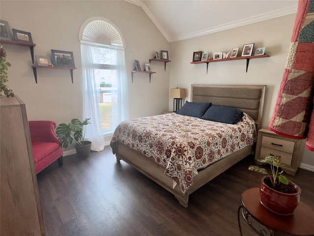 bedroom featuring lofted ceiling, baseboards, dark wood-type flooring, and ornamental molding