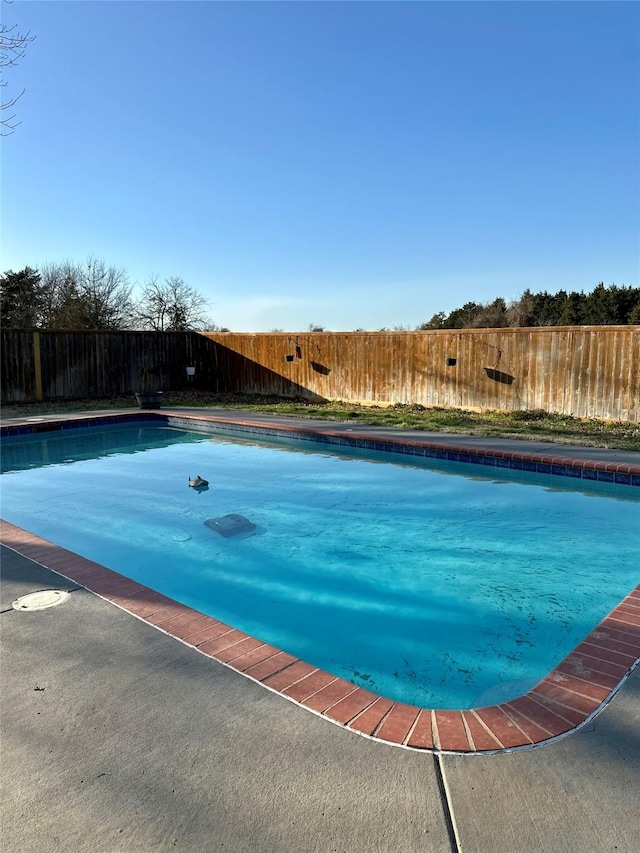 view of swimming pool featuring a fenced in pool and a fenced backyard