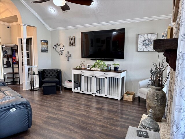 living room featuring plenty of natural light, lofted ceiling, and ornamental molding