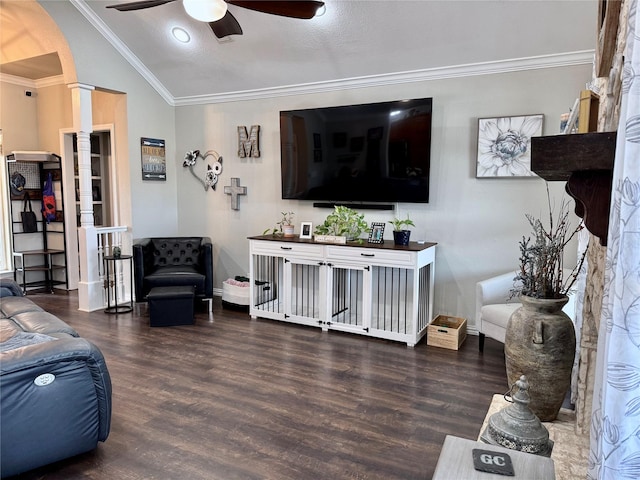 living room with ornamental molding, a ceiling fan, wood finished floors, decorative columns, and lofted ceiling