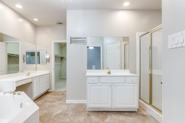 bathroom with shower with separate bathtub, tile patterned floors, and vanity