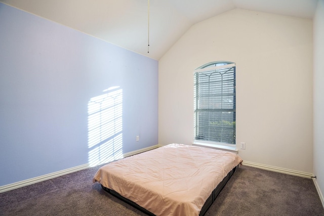 carpeted bedroom featuring lofted ceiling