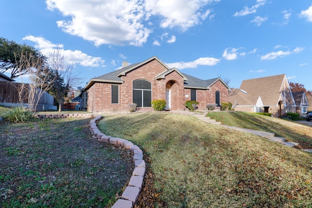 ranch-style home with a front yard